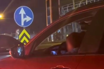 Kucağında çocukla araç kullanan sürücüye tepki yağdı