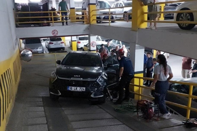 Otoparkta otomobilin altında kalan genç kadın yaralandı